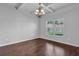 Cozy dining area featuring hardwood floors, decorative lighting, and natural light from the window at 4238 Sir Dixon Dr, Fairburn, GA 30213