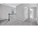 Hallway with carpet flooring, white walls, and a dark wood handrail at 4238 Sir Dixon Dr, Fairburn, GA 30213