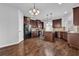 Spacious kitchen with dark wood cabinetry, stainless steel appliances, and a center island for meal prep at 4238 Sir Dixon Dr, Fairburn, GA 30213