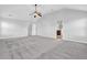 Spacious main bedroom with gray walls, carpet flooring, and vaulted ceilings with a ceiling fan at 4238 Sir Dixon Dr, Fairburn, GA 30213