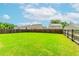 A large, well-maintained backyard with a wooden fence surrounding the perimeter at 431 Hinton Farm Way, Dacula, GA 30019