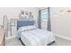 Charming bedroom with unique city skyline wall art and a cozy atmosphere at 431 Hinton Farm Way, Dacula, GA 30019