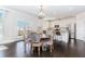 Bright open kitchen featuring stainless steel appliances, white cabinets, and a dining area at 431 Hinton Farm Way, Dacula, GA 30019