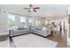 Spacious living room with hardwood floors, large windows, and seamless access to the kitchen and dining area at 431 Hinton Farm Way, Dacula, GA 30019