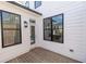 View of a wood back deck featuring black window trim and white siding at 502 Healy Dr # 76, Cumming, GA 30040