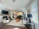Spacious living room with a fireplace, modern decor, and plenty of natural light from the large windows at 502 Healy Dr # 76, Cumming, GA 30040