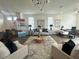 Bright, open living room with hardwood floors, neutral furniture, and a workspace at 502 Healy Dr # 76, Cumming, GA 30040