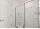 Bathroom featuring a glass-enclosed shower with sleek fixtures and modern design at 637 Kimberwick Dr, Locust Grove, GA 30248