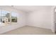 A bright bedroom with a window offering neighborhood views at 637 Kimberwick Dr, Locust Grove, GA 30248