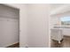 Walk-in closet with shelving for storage, located near the kitchen area at 637 Kimberwick Dr, Locust Grove, GA 30248