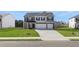 Charming two-story home with a well-manicured lawn and a two car garage at 637 Kimberwick Dr, Locust Grove, GA 30248