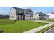 Traditional two-story home featuring gray facade, dual garage, well-maintained lawn, and attractive curb appeal at 637 Kimberwick Dr, Locust Grove, GA 30248