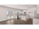 Bright kitchen featuring stainless steel appliances, granite countertops, and wood flooring at 637 Kimberwick Dr, Locust Grove, GA 30248