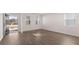 Light-filled living room boasts wood-look flooring and abundant windows, creating an inviting, airy atmosphere at 637 Kimberwick Dr, Locust Grove, GA 30248