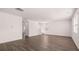 Spacious living room features wood flooring, and neutral walls with an open and airy feel at 637 Kimberwick Dr, Locust Grove, GA 30248