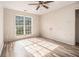 Bedroom featuring a window, ceiling fan and wood laminate flooring at 9066 Bob Jackson Dr, Jonesboro, GA 30238
