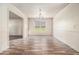 Light-filled dining room featuring decorative molding, neutral walls, and hardwood-style floors at 9066 Bob Jackson Dr, Jonesboro, GA 30238