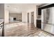 Open-concept kitchen and living room with wood-look flooring and a fireplace at 9066 Bob Jackson Dr, Jonesboro, GA 30238