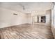 Open-concept living and dining area features wood-look flooring and abundant natural light at 9066 Bob Jackson Dr, Jonesboro, GA 30238
