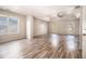 Spacious main bedroom featuring tray ceilings, ceiling fan, and wood-look flooring at 9066 Bob Jackson Dr, Jonesboro, GA 30238
