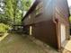 View of the rear exterior featuring a wood facade and garage at 2685 Hyde Cir, Duluth, GA 30096