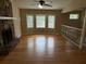 Open living area with a stone fireplace and hardwood floors at 2685 Hyde Cir, Duluth, GA 30096