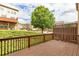 View from wooden back deck with railing showcasing the community at 275 Blue Pointe Ct, Suwanee, GA 30024
