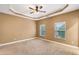 Comfortable bedroom with two windows that let in natural light at 275 Blue Pointe Ct, Suwanee, GA 30024