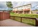 View from the deck shows the exterior of townhomes with multiple decks and brick accents at 275 Blue Pointe Ct, Suwanee, GA 30024