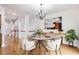 Dining area featuring hardwood floors and a contemporary light fixture at 275 Blue Pointe Ct, Suwanee, GA 30024