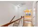 Upstairs hallway with carpeted stairs at 275 Blue Pointe Ct, Suwanee, GA 30024