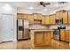 Spacious kitchen with wood cabinets, stainless steel appliances, and center island at 275 Blue Pointe Ct, Suwanee, GA 30024