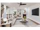 Spacious living room with a fireplace and staircase featuring stylish furnishings and decor at 275 Blue Pointe Ct, Suwanee, GA 30024