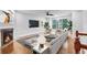 Bright and airy living room with a modern fireplace and hardwood flooring at 275 Blue Pointe Ct, Suwanee, GA 30024
