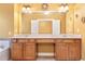 Bathroom featuring a double vanity with ample counter space and storage cabinets at 275 Blue Pointe Ct, Suwanee, GA 30024