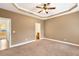 Spacious main bedroom features multiple closets, tray ceiling, and ensuite bathroom access at 275 Blue Pointe Ct, Suwanee, GA 30024