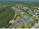 Wide aerial shot of the community with lush greenery, amenities, and a mix of housing options at 3786 Alstead Manor Way, Suwanee, GA 30024
