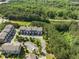 Aerial view of townhomes featuring well-kept landscaping, private entrances, and mature trees at 3786 Alstead Manor Way, Suwanee, GA 30024