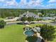 Aerial view featuring the community pool, clubhouse, tennis courts and a landscaped water feature at 3786 Alstead Manor Way, Suwanee, GA 30024
