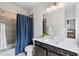 A well-lit bathroom with a tiled shower and a single vanity with great lighting at 3786 Alstead Manor Way, Suwanee, GA 30024