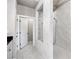 Elegant bathroom with marble-look tile, frameless shower, and stylish fixtures offering a spa-like experience at 3786 Alstead Manor Way, Suwanee, GA 30024