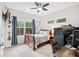 Cozy bedroom offers a comfortable space with room for a desk and musical instruments at 3786 Alstead Manor Way, Suwanee, GA 30024