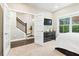 Bright bedroom featuring natural light and French door access to the hallway and stairs at 3786 Alstead Manor Way, Suwanee, GA 30024