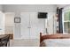 Second bedroom featuring a view through the window, and access to storage and closets at 3786 Alstead Manor Way, Suwanee, GA 30024