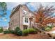 Attractive brick townhome with landscaped front yard and inviting entrance at 3786 Alstead Manor Way, Suwanee, GA 30024