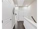Upstairs hallway with neutral paint, white trim, and dark hardwood floors at 3786 Alstead Manor Way, Suwanee, GA 30024