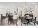Spacious kitchen with modern appliances and open floor plan into the dining area, creating a seamless flow at 3786 Alstead Manor Way, Suwanee, GA 30024