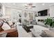 Open concept living room features a fireplace and comfortable seating, flowing into a separate office at 3786 Alstead Manor Way, Suwanee, GA 30024