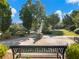 A tranquil park setting with benches and modern art at 3786 Alstead Manor Way, Suwanee, GA 30024