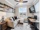 Bright and functional home office with natural light, modern desk, and comfortable seating area at 3786 Alstead Manor Way, Suwanee, GA 30024